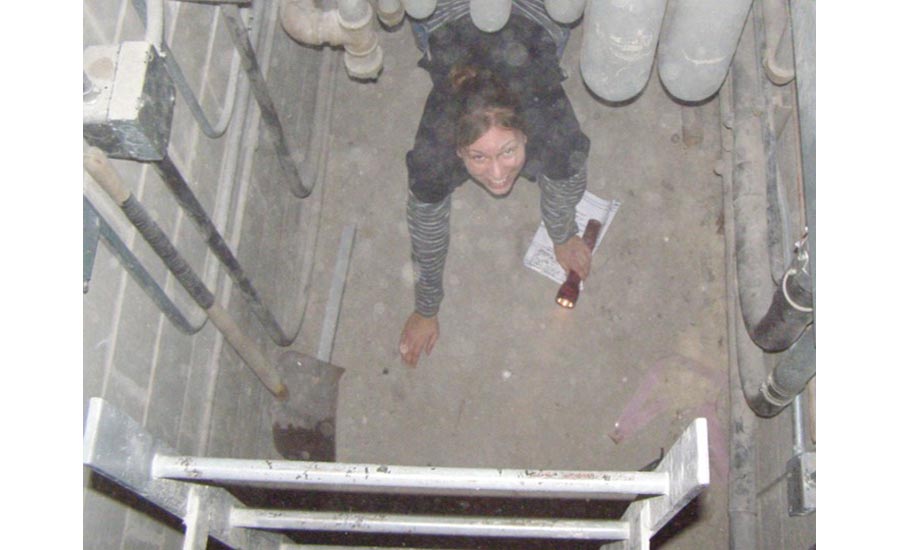 Brianne Hall crawls through a tunnel on a job site
