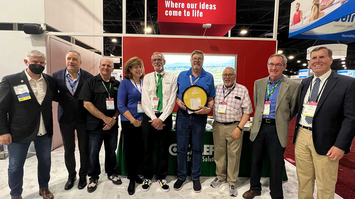 Carlson-Holohan Industry Award of Excellence founders and past recipients in the Caleffi North America booth during the 2023 AHR Expo.