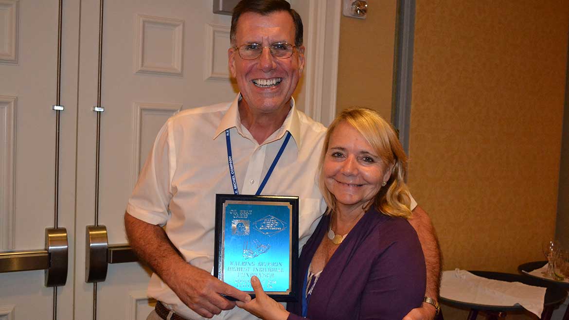 Dan and Marianne Holohan posing with their fundraising award at the OESP's Oil Heat Cares 2014