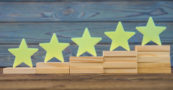 PME Top 20 Products of 2023 feature image of five wooden stars on the ladder upgrade rating of side-by-side stacked wooden blocks.