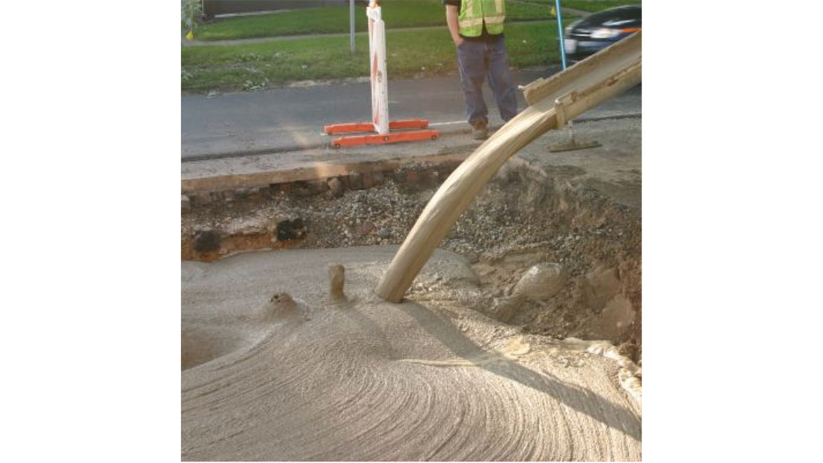 March 2024 John Siegenthaler Column Figure 3: "Flowable fill" pumped from a concrete truck into a void on the ground.