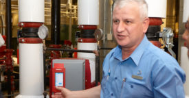 Armstrong Fluid Technology's David Lee pictured alongside smart pump system.